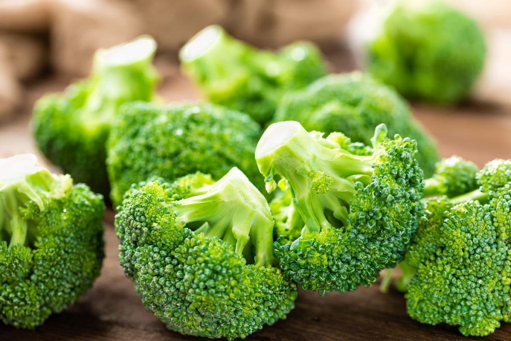 fresh broccoli on wooden background 